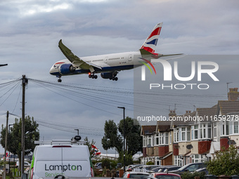 British Airways Boeing 787-8 Dreamliner aircraft spotted flying on final approach over the roofs of the houses of Myrtle avenue for landing...