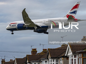 British Airways Boeing 787-8 Dreamliner aircraft spotted flying on final approach over the roofs of the houses of Myrtle avenue for landing...