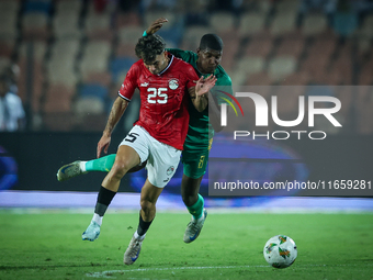 Ahmed Mostafa of Egypt battles for possession with Mouhsine Bodda of Mauritania during Africa Cup of Nations Qualifiers 2025 match number 61...