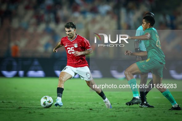 Ahmed Mostafa of Egypt battles for possession with Oumar Jacky Ngom of Mauritania during Africa Cup of Nations qualifiers 2025 match number...