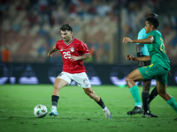 Ahmed Mostafa of Egypt battles for possession with Oumar Jacky Ngom of Mauritania during Africa Cup of Nations qualifiers 2025 match number...