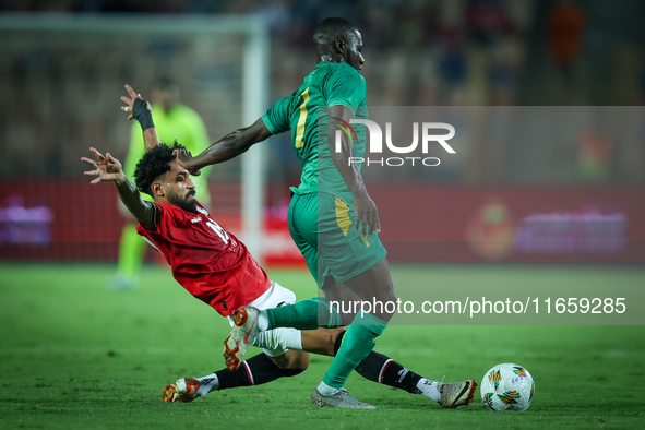 Marawan Attia of Egypt battles for possession with Aboubakary Koita of Mauritania during the Africa Cup of Nations Qualifiers 2025, match nu...