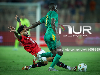 Marawan Attia of Egypt battles for possession with Aboubakary Koita of Mauritania during the Africa Cup of Nations Qualifiers 2025, match nu...