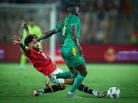 Marawan Attia of Egypt battles for possession with Aboubakary Koita of Mauritania during the Africa Cup of Nations Qualifiers 2025, match nu...