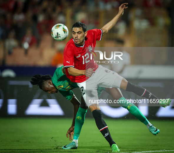 Mohamed Hamdy of Egypt battles for possession with Keita Ibrahima of Mauritania during the Africa Cup of Nations Qualifiers 2025, match numb...