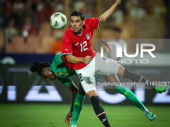 Mohamed Hamdy of Egypt battles for possession with Keita Ibrahima of Mauritania during the Africa Cup of Nations Qualifiers 2025, match numb...