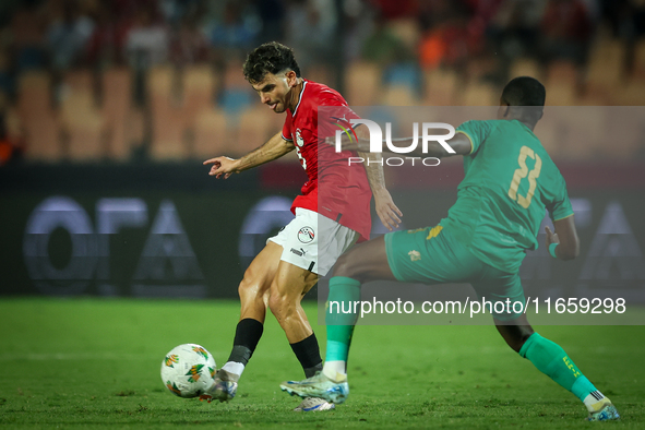 Ahmed Mostafa of Egypt battles for possession with Mouhsine Bodda of Mauritania during Africa Cup of Nations Qualifiers 2025 match number 61...