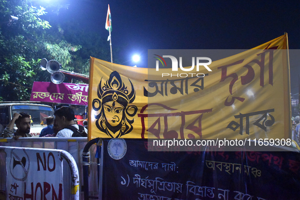 Citizens attend the Junior Doctors hunger strike to protest the rape and murder case of a medic in a government-run hospital in Kolkata, Ind...