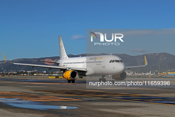 An Airbus A320-232 from Vueling is on the runway ready to take off from Barcelona airport in Barcelona, Spain, on October 8, 2024. 