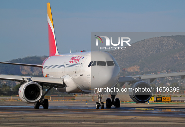 An Airbus A320-214 from Iberia is on the runway ready to take off from Barcelona airport in Barcelona, Spain, on October 8, 2024. 