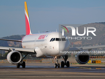 An Airbus A320-214 from Iberia is on the runway ready to take off from Barcelona airport in Barcelona, Spain, on October 8, 2024. (