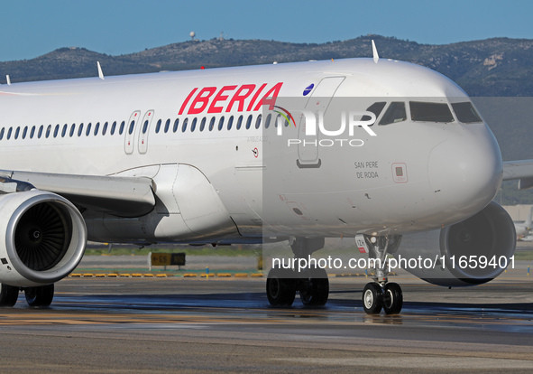 An Airbus A320-214 from Iberia is on the runway ready to take off from Barcelona airport in Barcelona, Spain, on October 8, 2024. 