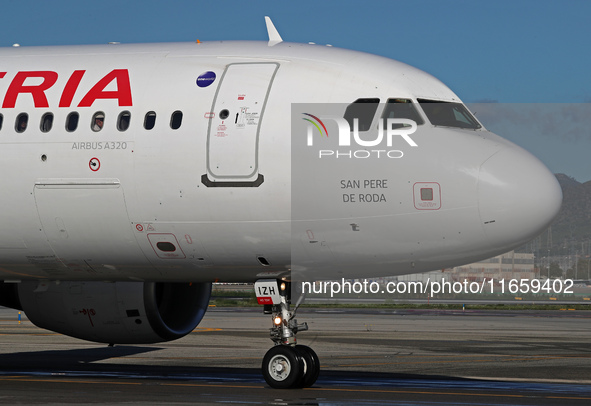 An Airbus A320-214 from Iberia is on the runway ready to take off from Barcelona airport in Barcelona, Spain, on October 8, 2024. 