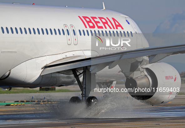 An Airbus A320-214 from Iberia is on the runway ready to take off from Barcelona airport in Barcelona, Spain, on October 8, 2024. 