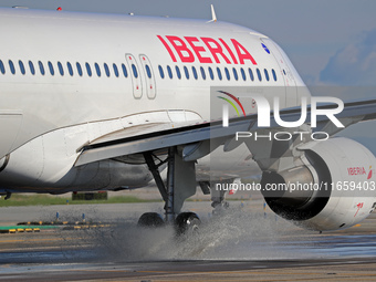 An Airbus A320-214 from Iberia is on the runway ready to take off from Barcelona airport in Barcelona, Spain, on October 8, 2024. (