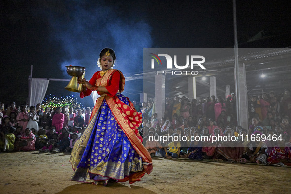 Female dance performers perform in front of an idol of the goddess Durga during the Durga Puja festival in Sylhet, Bangladesh, on October 12...