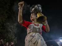 Female dance performers perform in front of an idol of the goddess Durga during the Durga Puja festival in Sylhet, Bangladesh, on October 12...