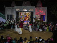 Bengali Hindu devotees watch a dance performance in front of an idol of the goddess Durga during the Durga Puja festival in Sylhet, Banglade...