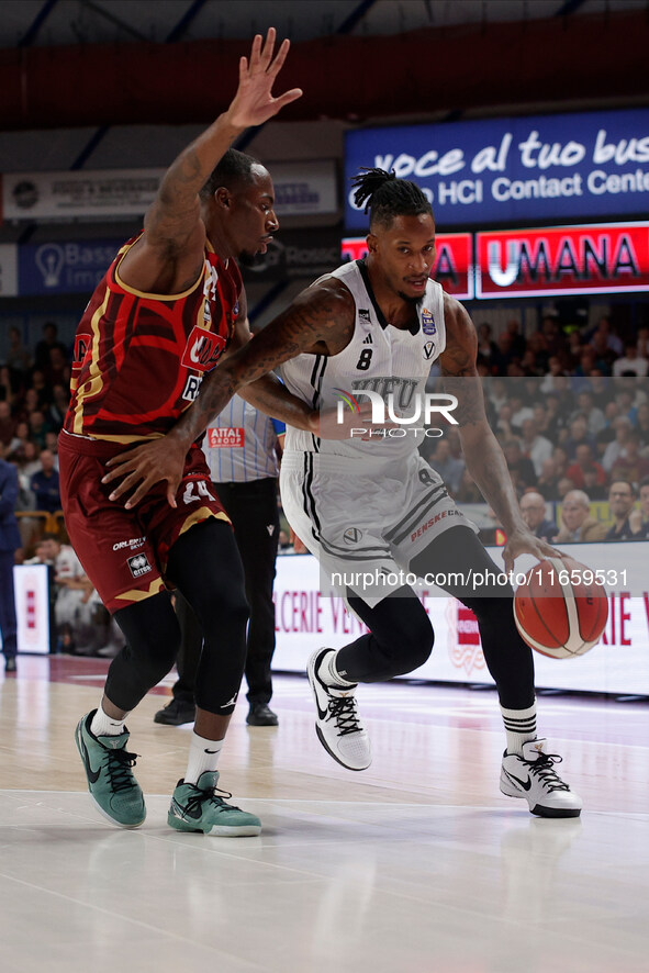 Will Clyburn of Virtus Bologna plays against Carl Wheatle of Umana Reyer during the Italian LBA basketball championship match between Umana...