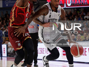 Will Clyburn of Virtus Bologna plays against Carl Wheatle of Umana Reyer during the Italian LBA basketball championship match between Umana...