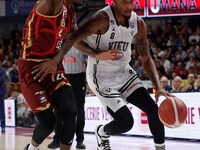 Will Clyburn of Virtus Bologna plays against Carl Wheatle of Umana Reyer during the Italian LBA basketball championship match between Umana...