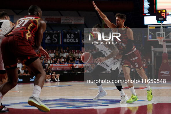 Daniel Hackett of Virtus Bologna plays against Davide Moretti of Umana Reyer during the Italian LBA basketball championship match between Um...