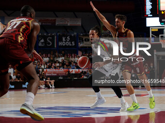 Daniel Hackett of Virtus Bologna plays against Davide Moretti of Umana Reyer during the Italian LBA basketball championship match between Um...