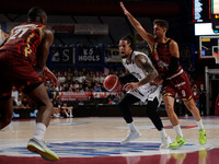 Daniel Hackett of Virtus Bologna plays against Davide Moretti of Umana Reyer during the Italian LBA basketball championship match between Um...