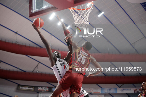 Momo Diouf of Virtus Bologna plays against Aamir Simms of Umana Reyer during the Italian LBA basketball championship match between Umana Rey...