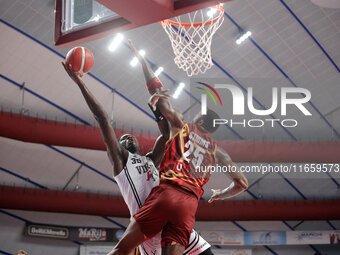 Momo Diouf of Virtus Bologna plays against Aamir Simms of Umana Reyer during the Italian LBA basketball championship match between Umana Rey...