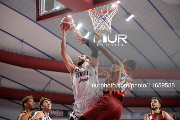 Tornik'e Shengelia of Virtus Bologna plays against Carl Wheatle of Umana Reyer during the Italian LBA basketball championship match between...