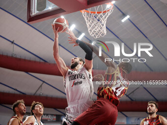 Tornik'e Shengelia of Virtus Bologna plays against Carl Wheatle of Umana Reyer during the Italian LBA basketball championship match between...