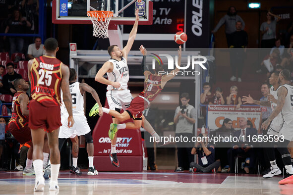 Umana Reyer's Davide Moretti competes against Virtus Bologna's Ante Zizic during the Italian LBA basketball championship match between Umana...