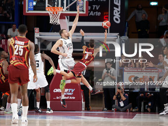 Umana Reyer's Davide Moretti competes against Virtus Bologna's Ante Zizic during the Italian LBA basketball championship match between Umana...