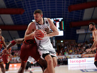 Ante Zizic of Virtus Bologna competes against Aamir Simms of Umana Reyer during the Italian LBA basketball championship match between Umana...