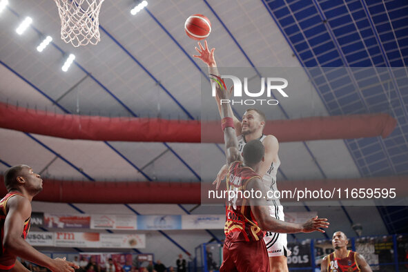 Ante Zizic of Virtus Bologna competes against Aamir Simms of Umana Reyer during the Italian LBA basketball championship match between Umana...