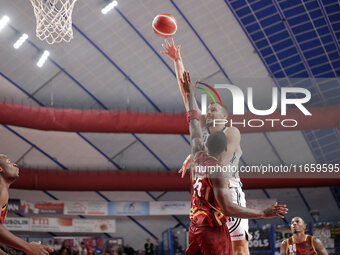 Ante Zizic of Virtus Bologna competes against Aamir Simms of Umana Reyer during the Italian LBA basketball championship match between Umana...