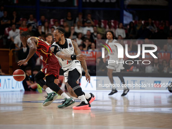 Umana Reyer's Carl Wheatle competes against Virtus Bologna's Rayjon Tucker during the Italian LBA basketball championship match between Uman...