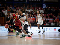 Umana Reyer's Carl Wheatle competes against Virtus Bologna's Rayjon Tucker during the Italian LBA basketball championship match between Uman...