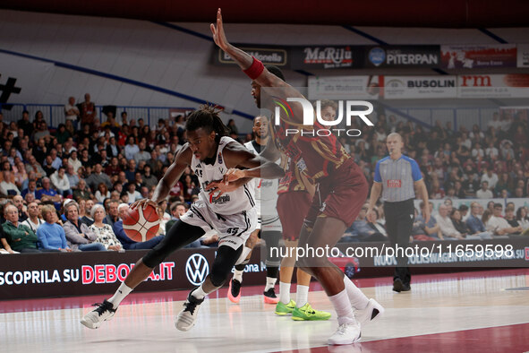 Nicola Akele of Virtus Bologna plays against Aamir Simms of Umana Reyer during the Italian LBA basketball championship match between Umana R...