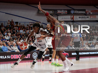 Nicola Akele of Virtus Bologna plays against Aamir Simms of Umana Reyer during the Italian LBA basketball championship match between Umana R...