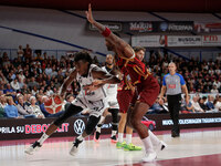 Nicola Akele of Virtus Bologna plays against Aamir Simms of Umana Reyer during the Italian LBA basketball championship match between Umana R...