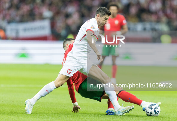 Diogo Dalot , Robert Lewandowski  during UEFA Nations League match Poland vs Portugal in Warsaw Poland on 12 October 2024. 