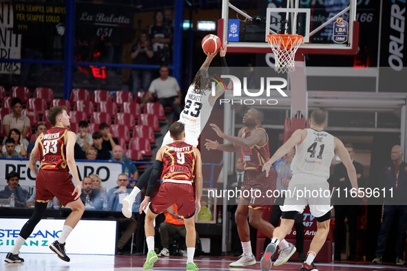 Achille Polonara of Virtus Bologna competes against Mfiondo Kabangele and Davide Moretti of Umana Reyer during the Italian LBA basketball ch...