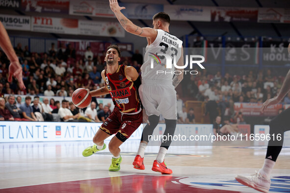 Umana Reyer's Davide Moretti competes against Virtus Bologna's Achille Polonara during the Italian LBA basketball championship match between...