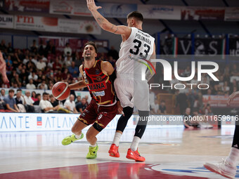 Umana Reyer's Davide Moretti competes against Virtus Bologna's Achille Polonara during the Italian LBA basketball championship match between...