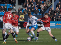 Barrow's Ged Garner is in action with Morecambe's Tom White during the Sky Bet League 2 match between Barrow and Morecambe at Holker Street...