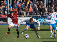 Barrow's Ged Garner is in action with Morecambe's Callum Jones during the Sky Bet League 2 match between Barrow and Morecambe at Holker Stre...