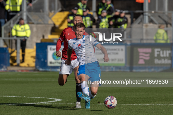 Dean Campbell plays during the Sky Bet League 2 match between Barrow and Morecambe at Holker Street in Barrow-in-Furness, England, on Octobe...