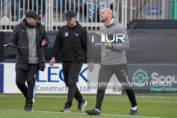 Barrow assistant manager Robbie Stockdale (left) converses with Barrow manager Stephen Clemence during the Sky Bet League 2 match between Ba...